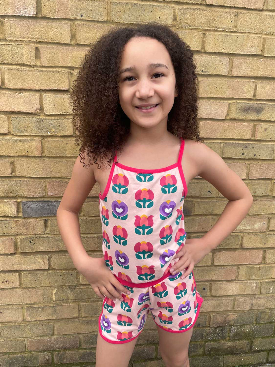 Child wearing the Maxomorra Picnic Tulip Short Jumpsuit