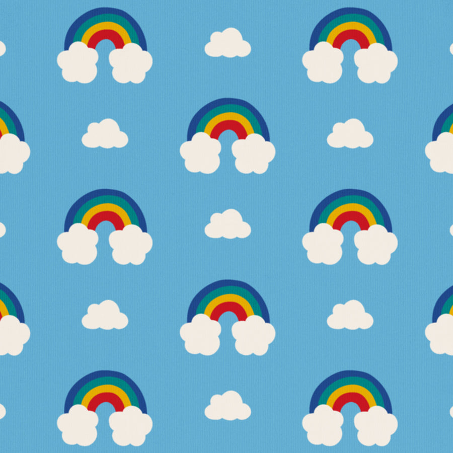 A close up of the Maxomorra Rainbow print showing the light blue colour with the rainbow and cloud print