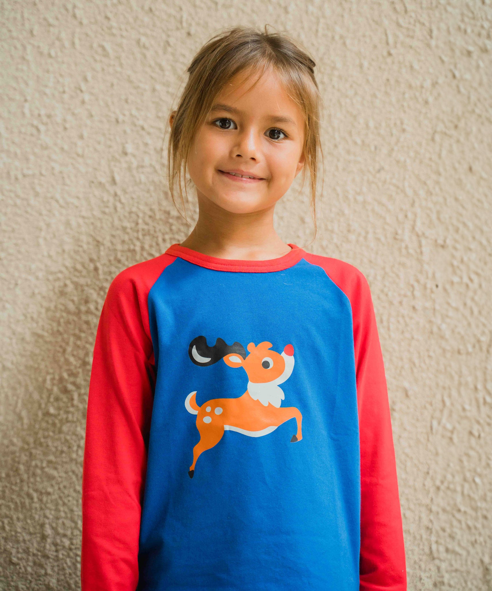 A close up of the reindeer on the Maxomorra Reindeer Raglan Long Sleeve Top. 