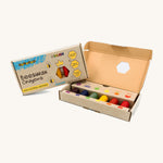 An open box of Medenka junior beeswax crayons, with six brightly coloured, thick crayons.