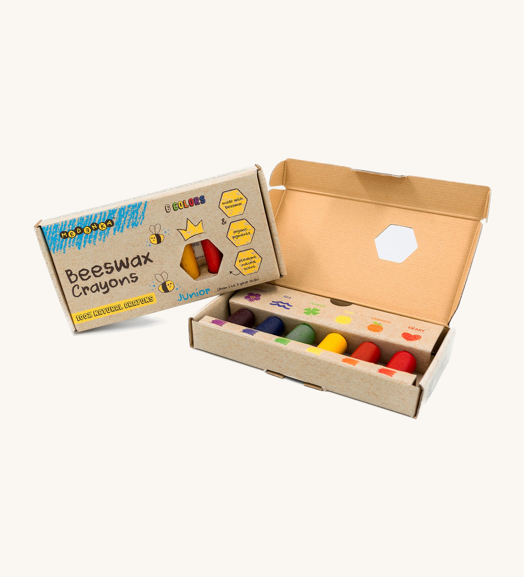 An open box of Medenka junior beeswax crayons, with six brightly coloured, thick crayons.