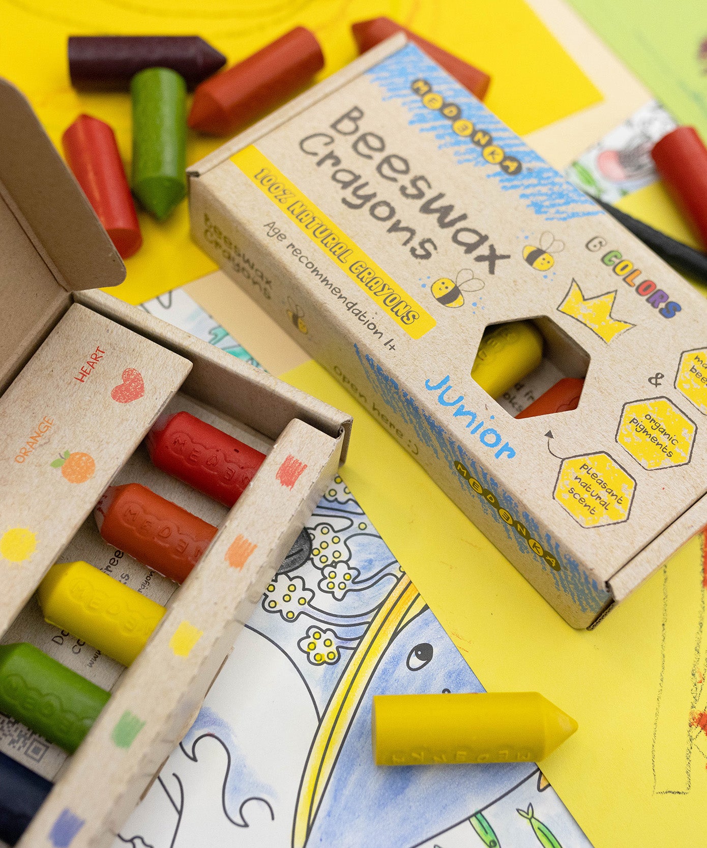 The Medenka natural beeswax crayons in their cardboard boxes.