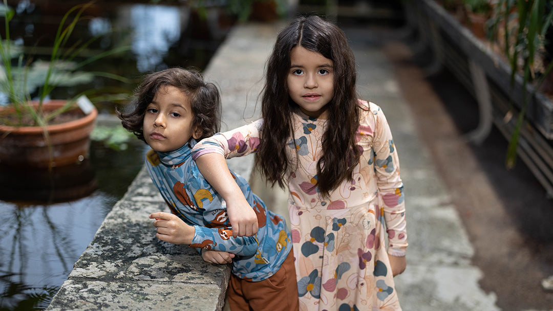 Two kids dressed in Meyadey organic cotton clothing