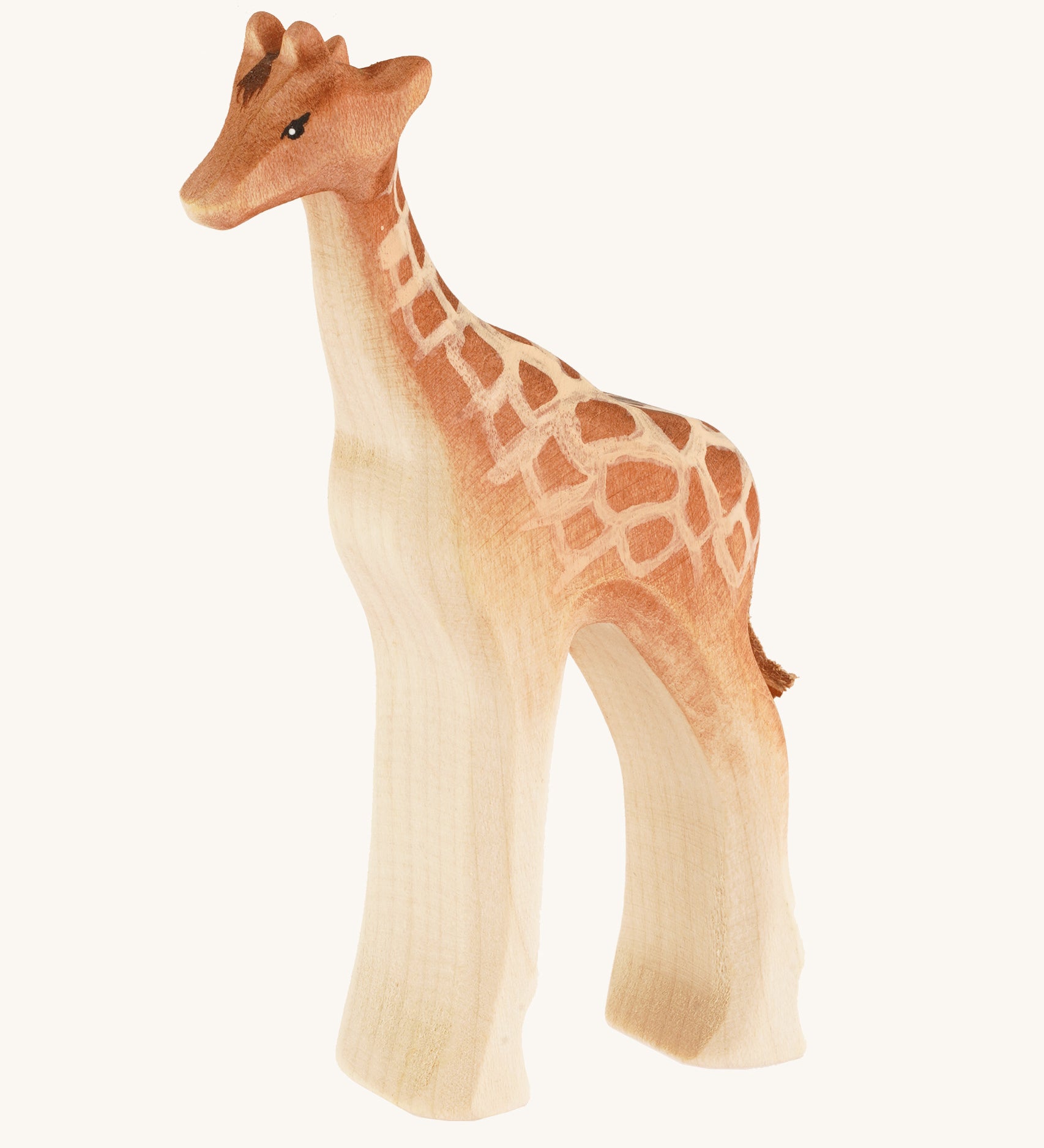 Bumbu wooden standing female giraffe on a cream background