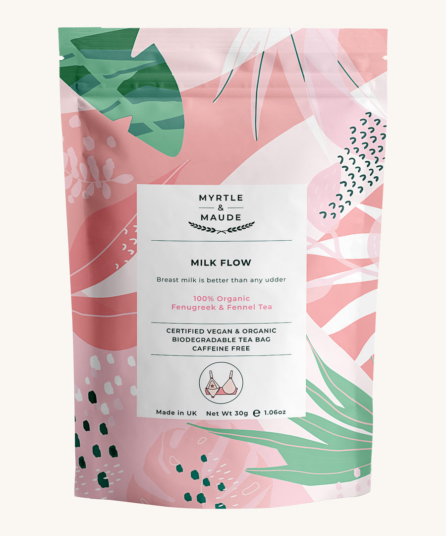 Pink with leaves milk flow tea pouch on a cream background.