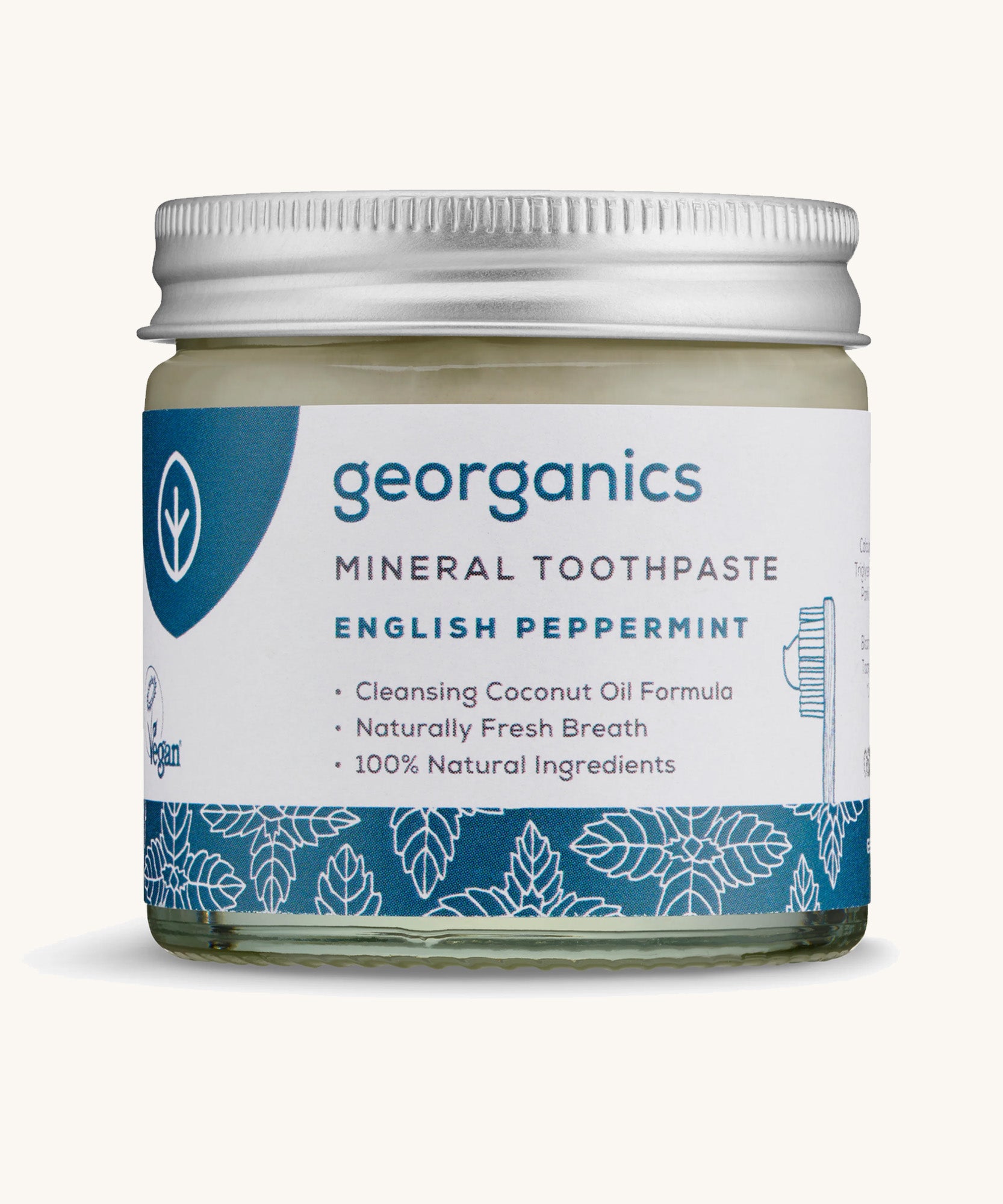 A jar of the Georganics English peppermint mineral toothpaste on a cream background.