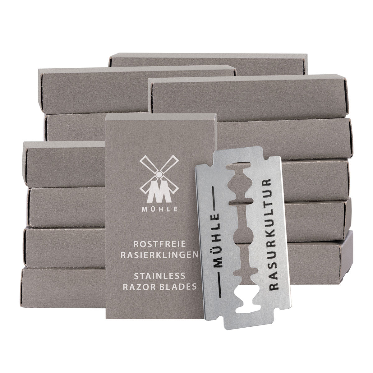 Packs of Muhle stainless steel reusable safety razor blades stacked on a white background