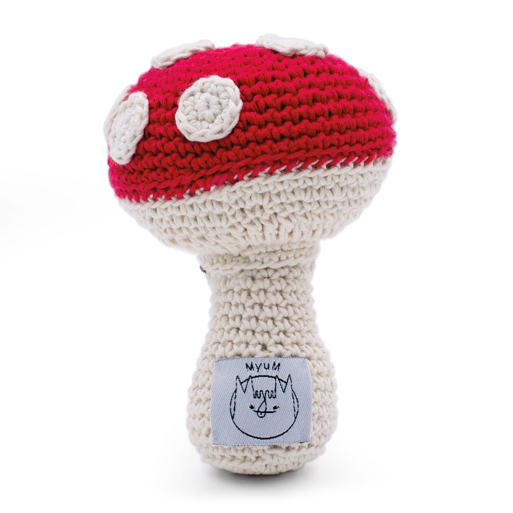 Back of the plastic free handmade Myum red toadstool soft toy on a white background