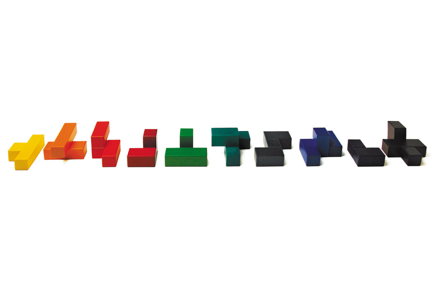 Pieces of the Naef campanile eco-friendly wooden block puzzle laid out on a white background