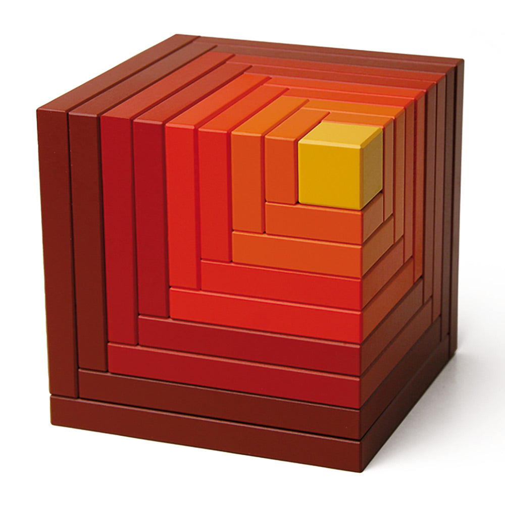 Naef's Cella stacking cube toy in red on a white background. Toy is in its original cube form.