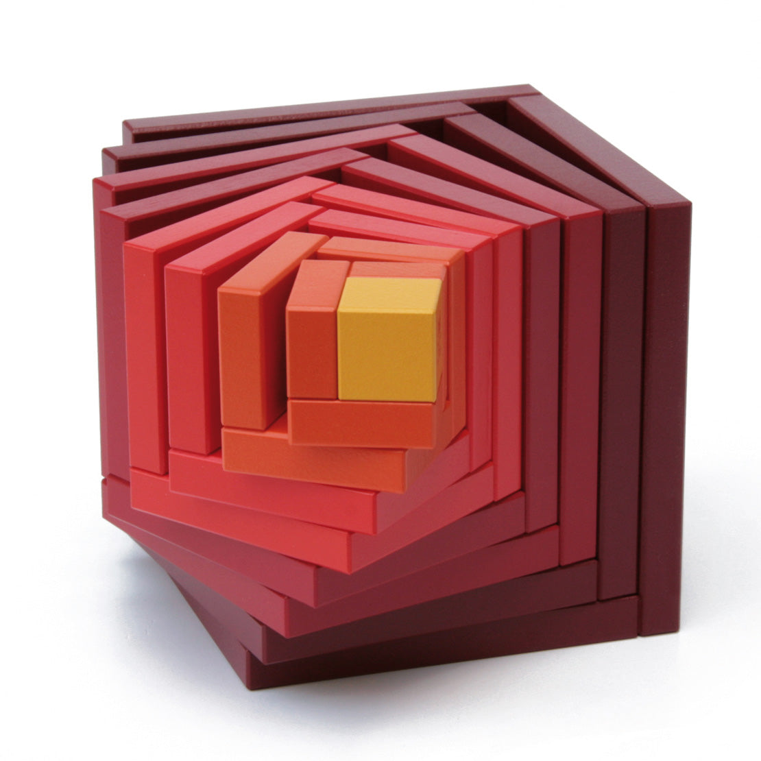 Naef Cella Stacking Cube in a red colour shown with pieces pulled slightly apart pictured on a plain background