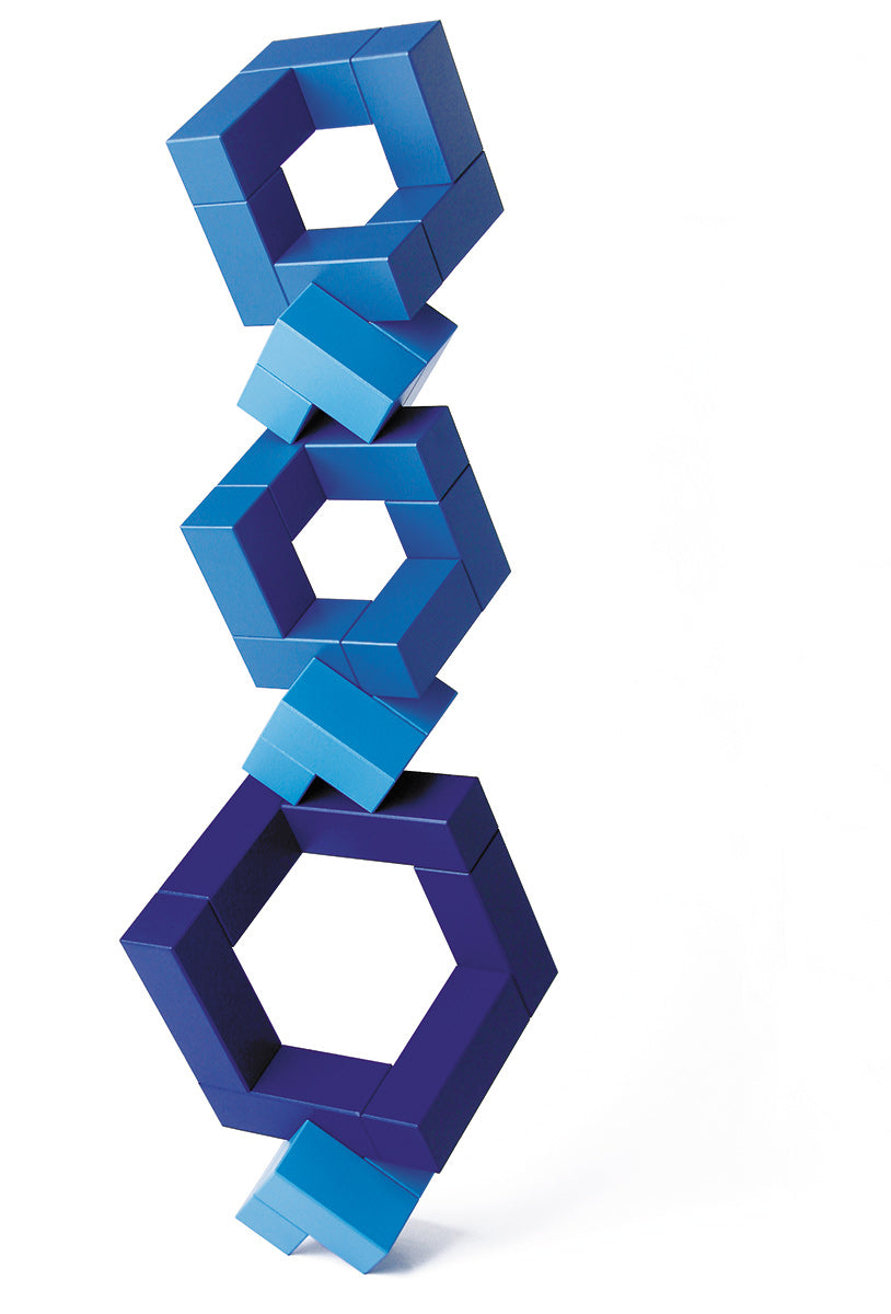 Blue Naef Cubicus stacked in a complex geometric tower on a white background.