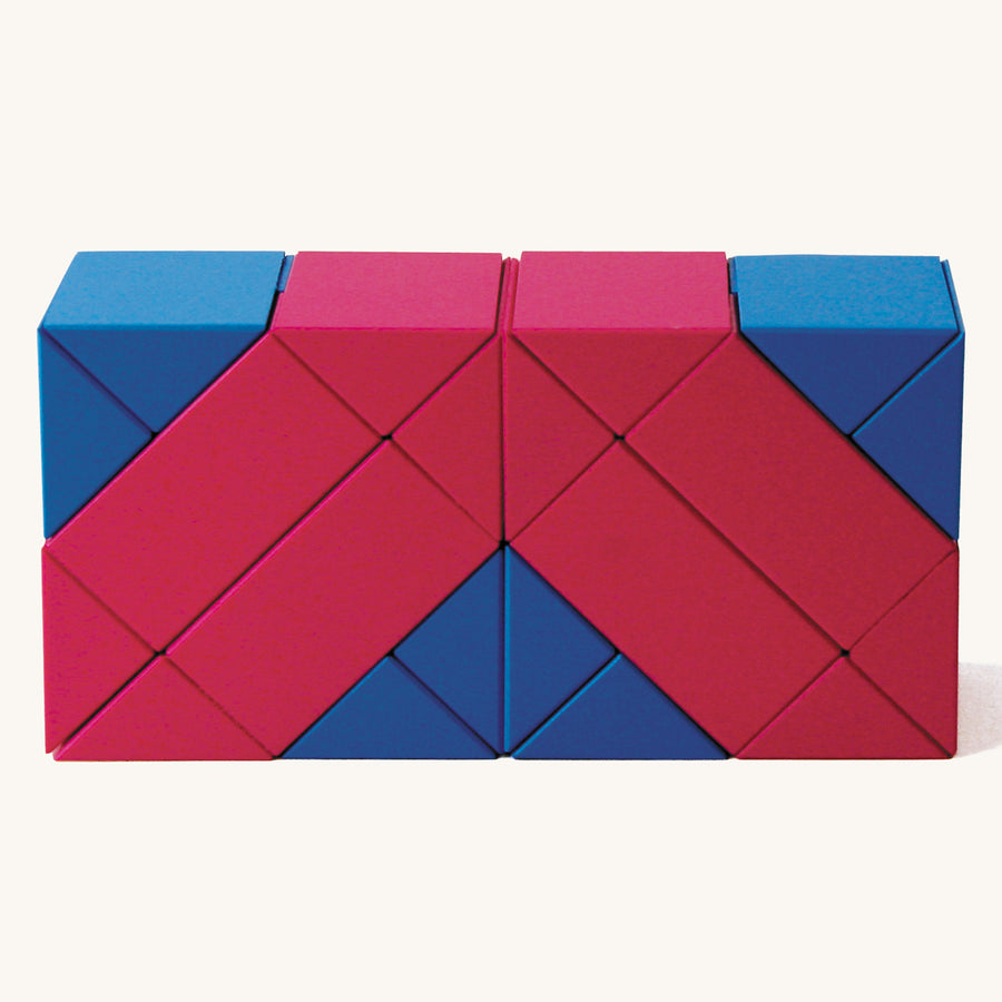 Naef ponte premium manufactured wooden toy blocks in the red and blue colours laid out in a rectangle shape on a beige background