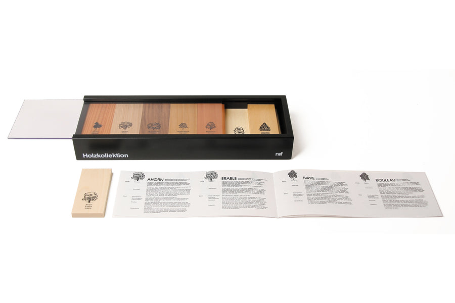 Naef premium wooden block set in its collector box on a white background