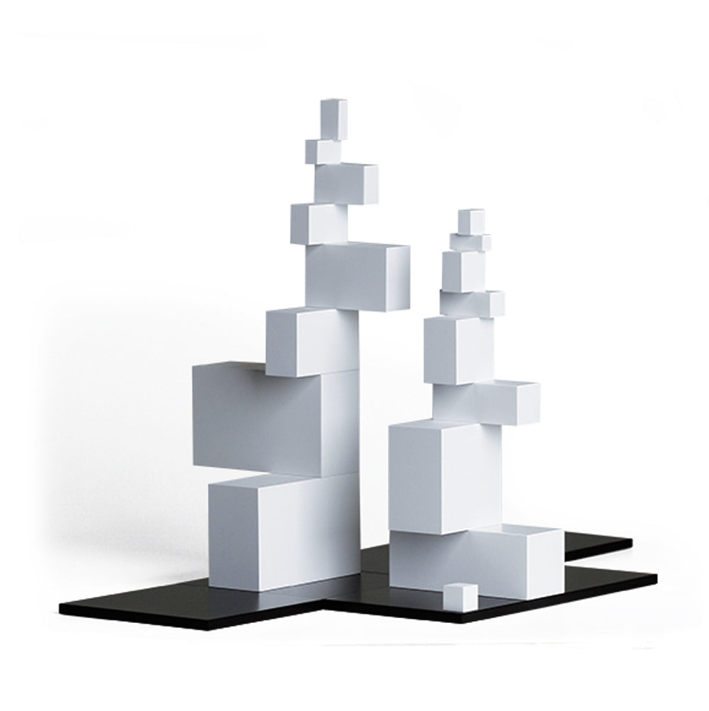 Naef tectus black and white geometric stacking toy made into an unorthodox tower on a white background