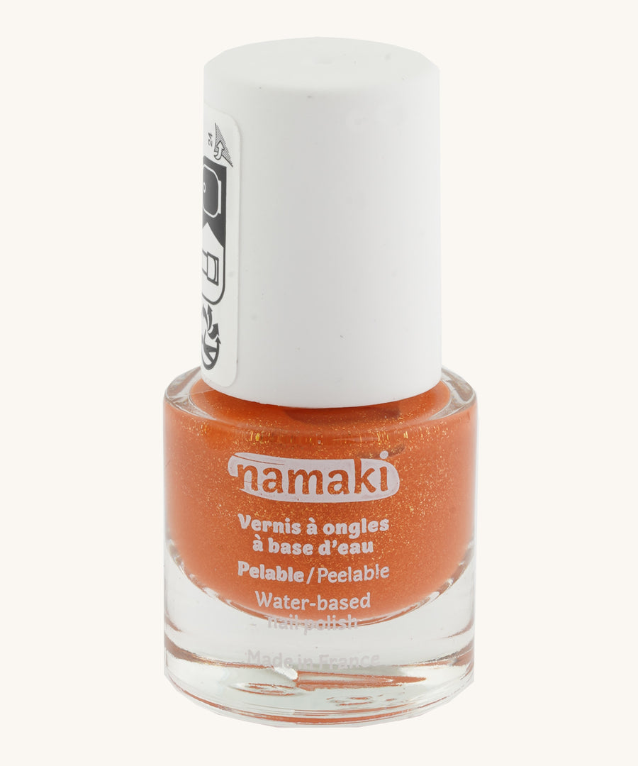 Orange Namaki nail polish from the fairy moonlight set on a cream background.