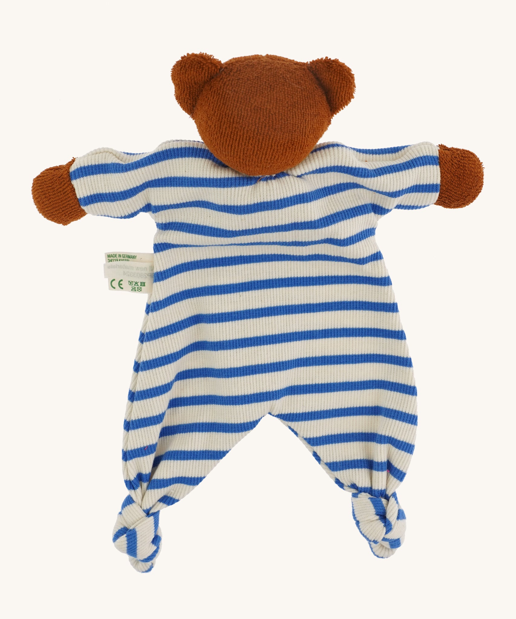 The back of the handmade teddy bear comforter toy, the Nanchen Baby Comforter - Bear has brown face and  hands, and a blue and white stripe body