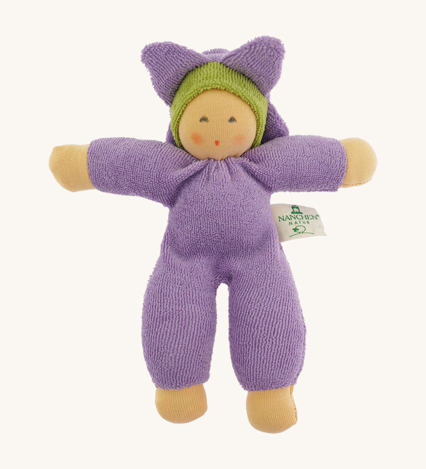 The Nanchen Flower Fairy Rattle Doll as a soft lilac terry material body, with a pretty lilac terry material hat in the shape of a flower, and a green terry strip of fabric just under the hat