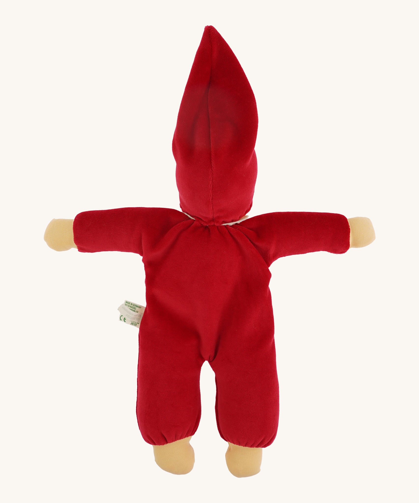 The back of the Nanchen Waldorf Nani Doll This hand crafted doll toy has a red fabric, soft body with a small white collar and red pointy hat. On a cream background