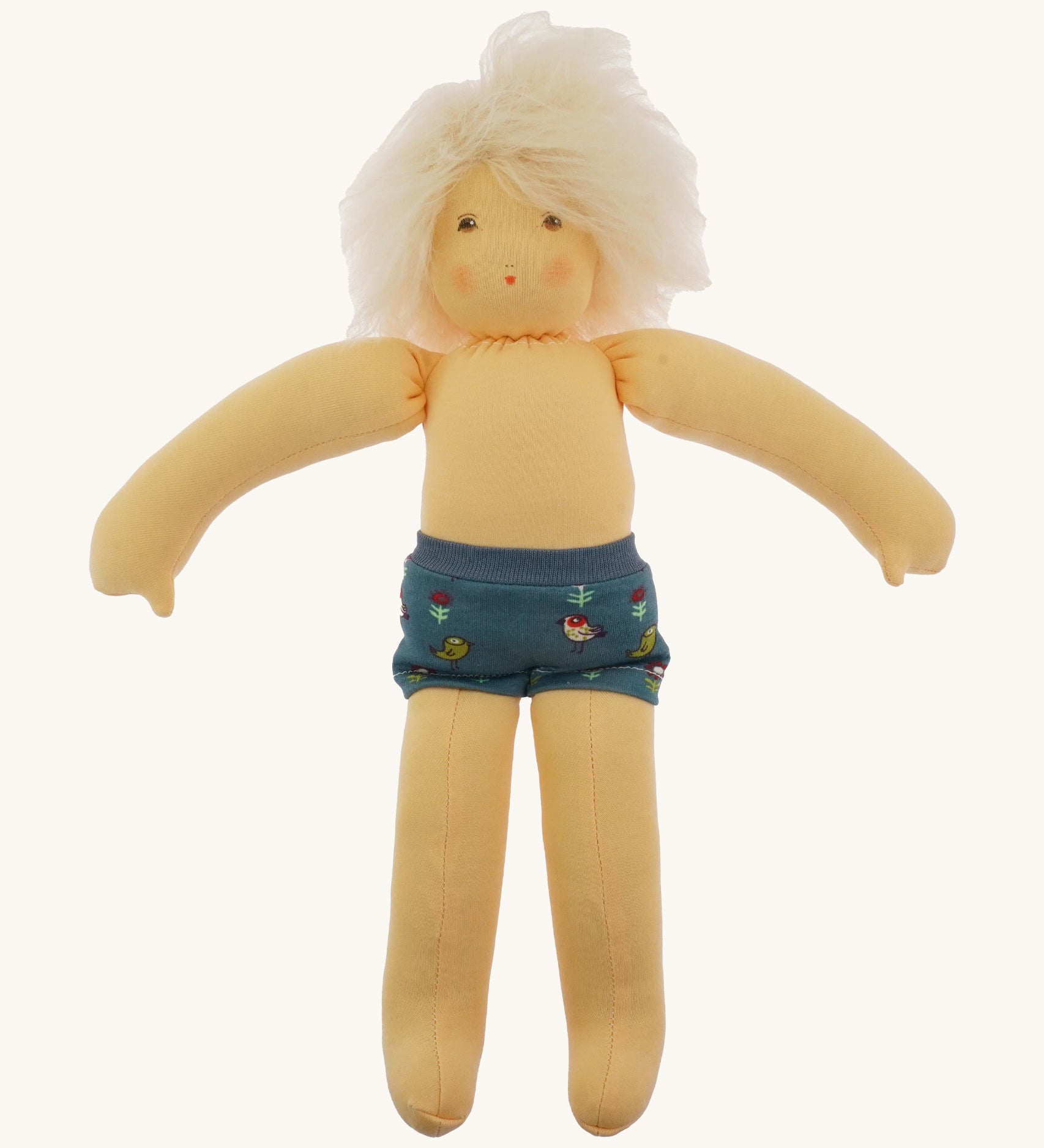 Nanchen Waldorf Doll - Lotte, an organic doll wearing blue pants.