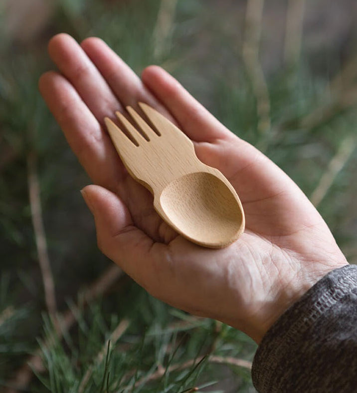 A Bambu Bamboo Spork pictured in an adult's hand