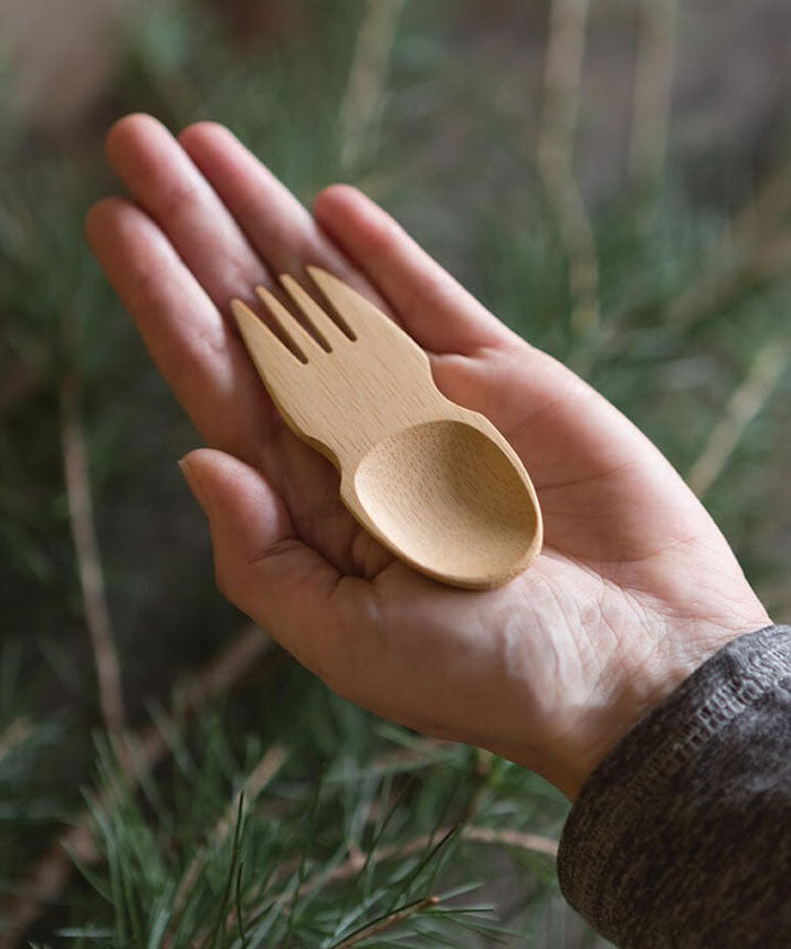 A Bambu Bamboo Spork pictured in an adult's hand