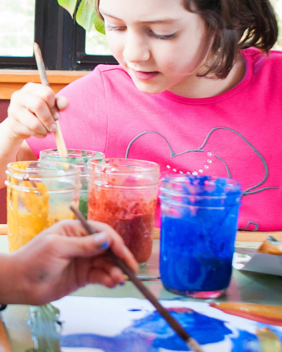 Close up of a girl painting with the Natural Earth eco-friendly painting kit