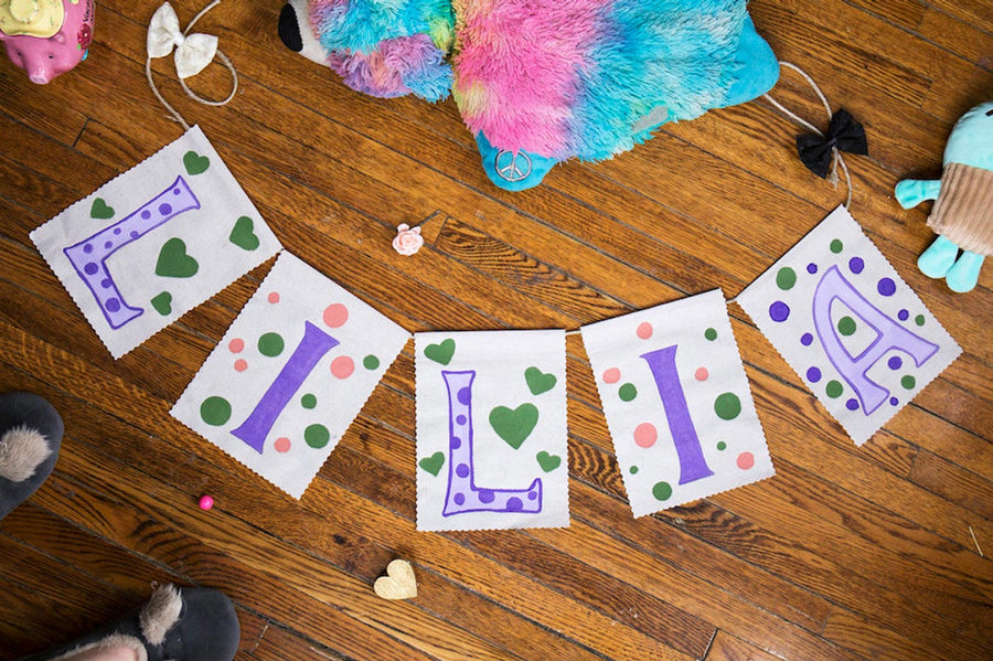 Natural Earth decorative craft flags laid out on a wooden floor