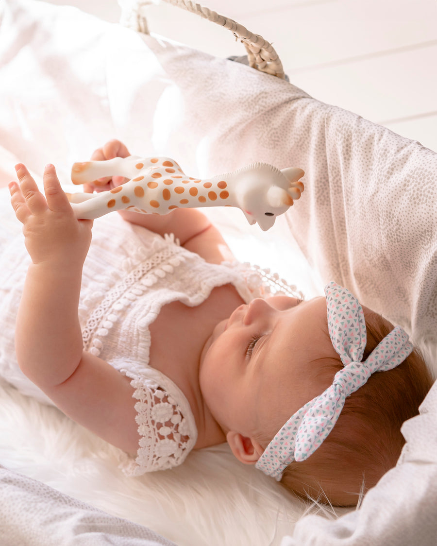 A child laid in a baby basket