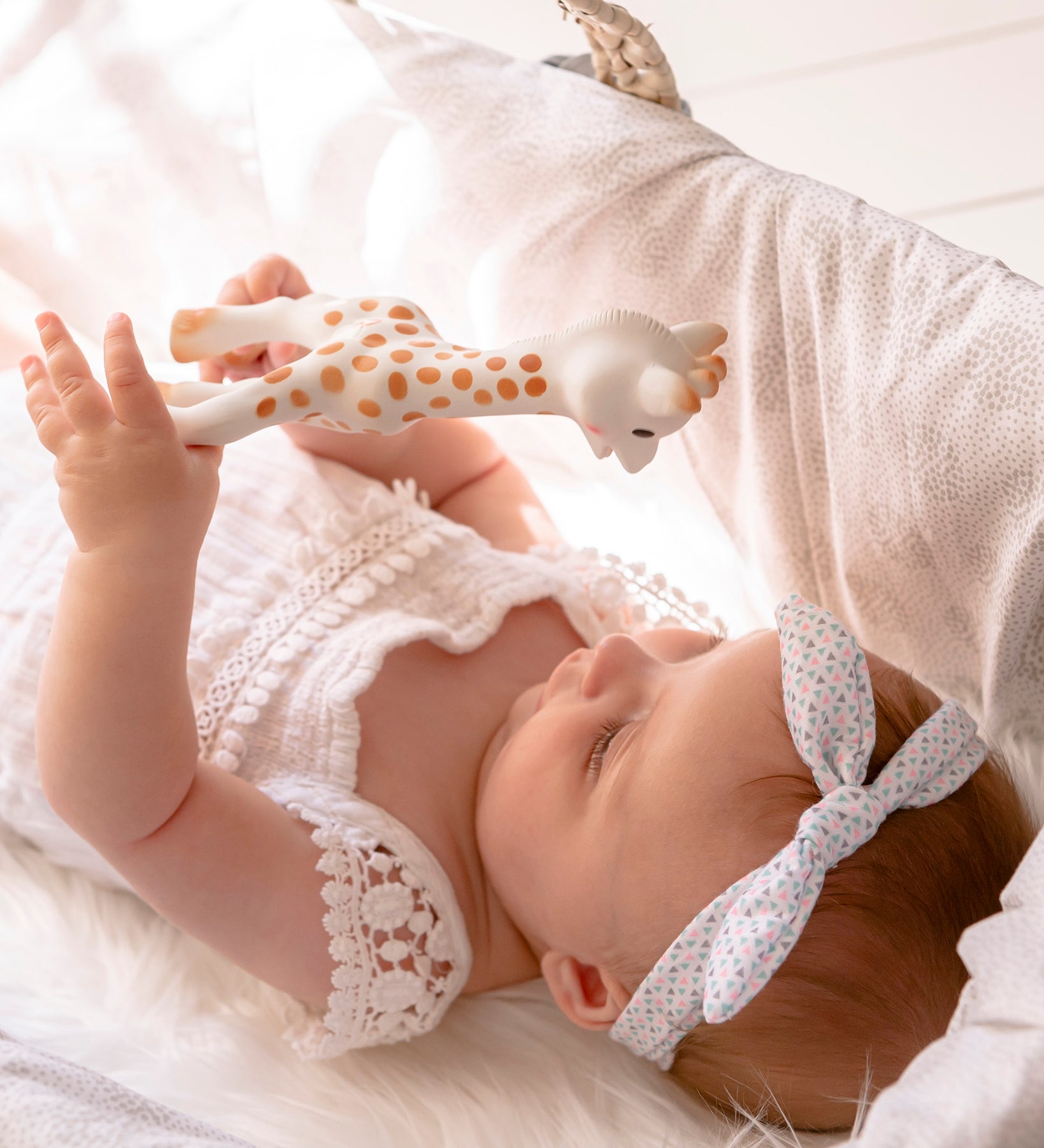 A child laid in a baby basket