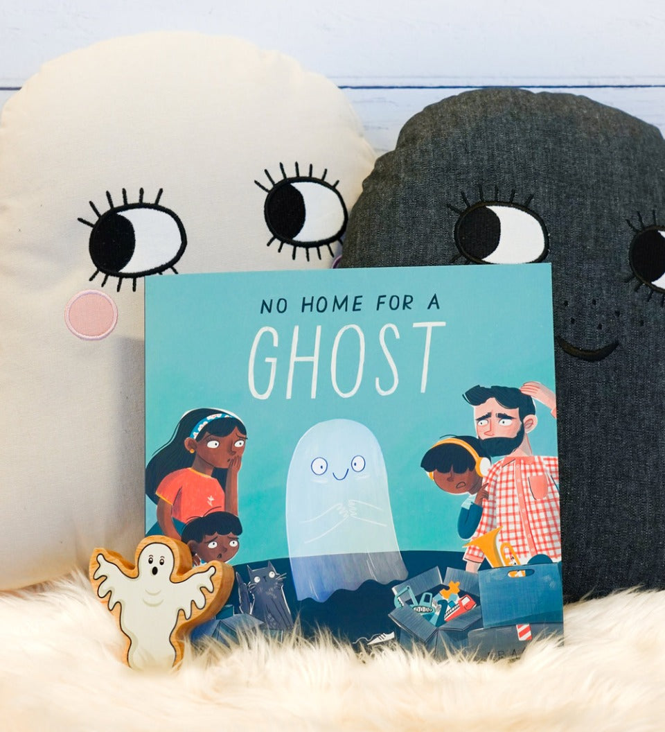 No Home for a Ghost kids book from Owlet Press on a fluffy blanket next to some Roommate Ghost cushions