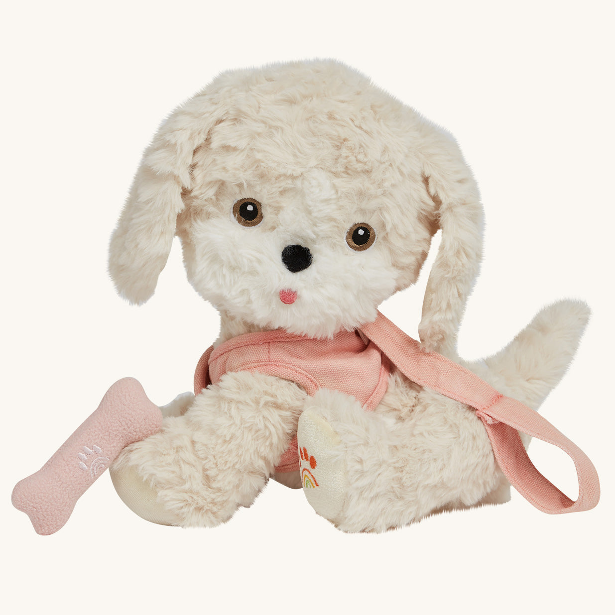 The Olli Ella Dinkum Dog "Cookie" is a dog shaped stuffed toy with soft cream coloured fur