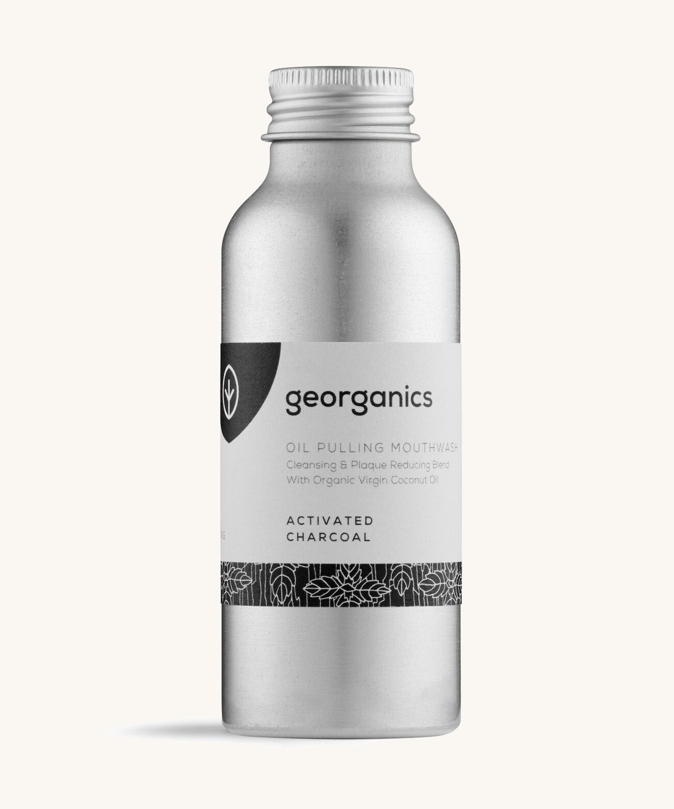 A bottle of the Georganics activated charcoal oil pulling mouthwash on a cream background.