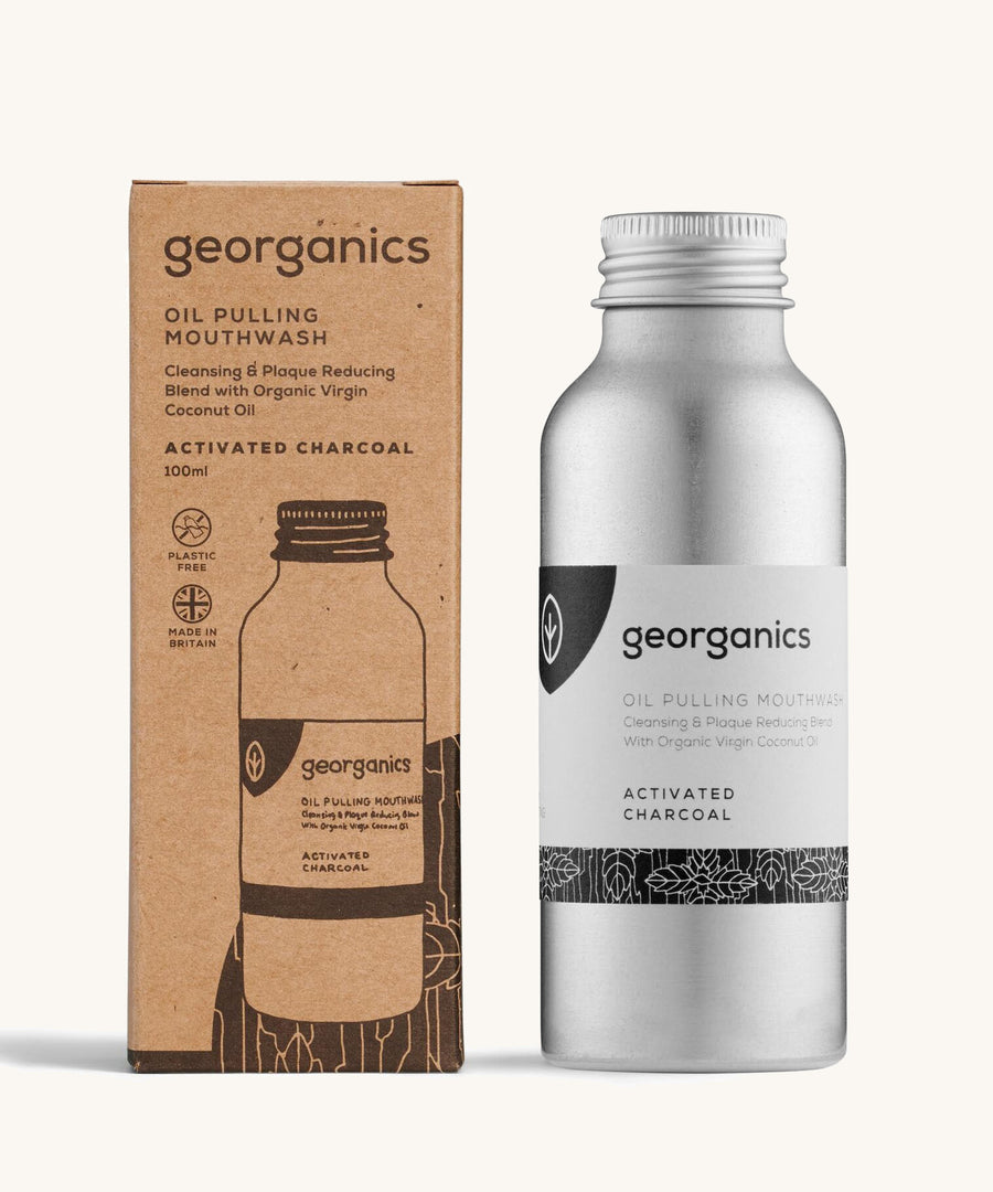 A bottle of the Georganics activated charcoal oil pulling mouthwash with the box