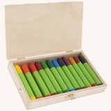 OkoNorm 12 Beeswax Crayons in a  Wooden Box, shown with the lid open and the crayons inside. 