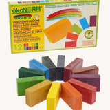 OkoNorm 12 Coloured Wax Crayon Blocks. Pictured next to their cardboard packaging box.