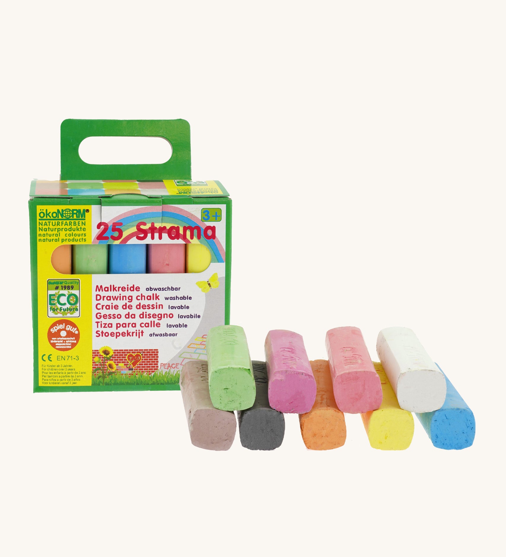 Okonorm multicoloured drawing chalks stacked next to the green and yellow cardboard packaging 