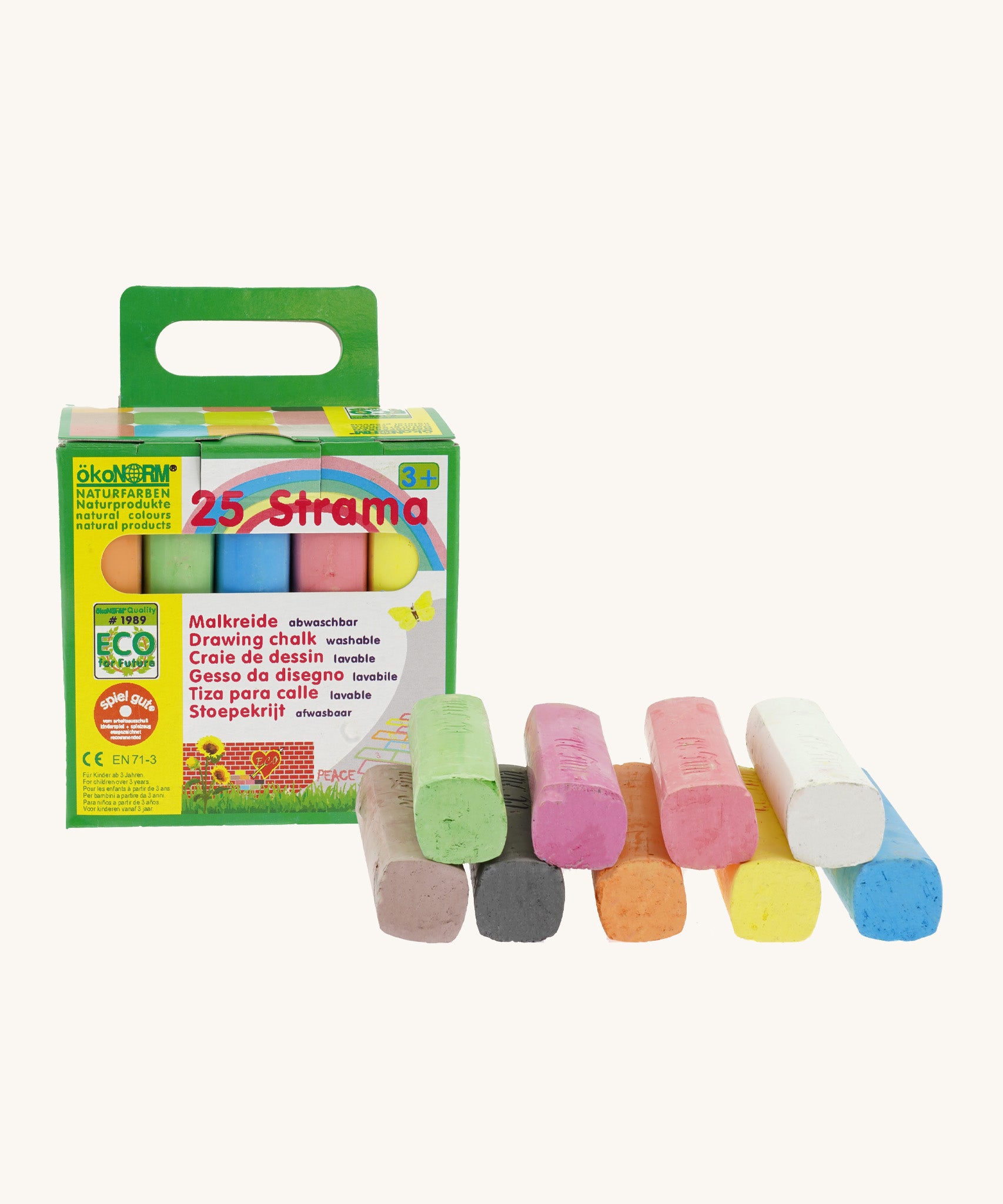 Okonorm multicoloured drawing chalks stacked next to the green and yellow cardboard packaging 