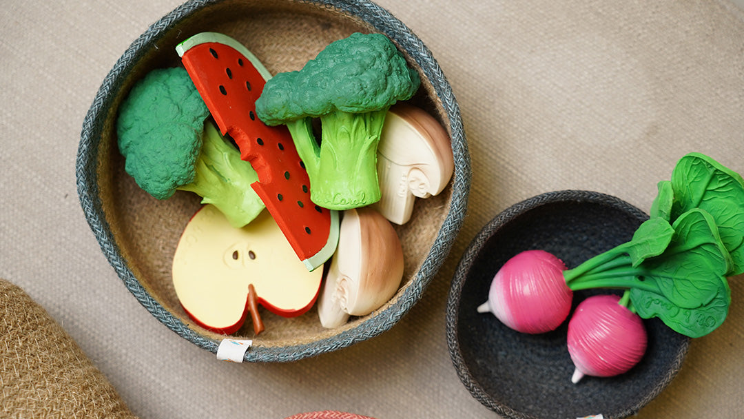 Oli and Carol rubber teething toy vegetables in ReSpiin baskets