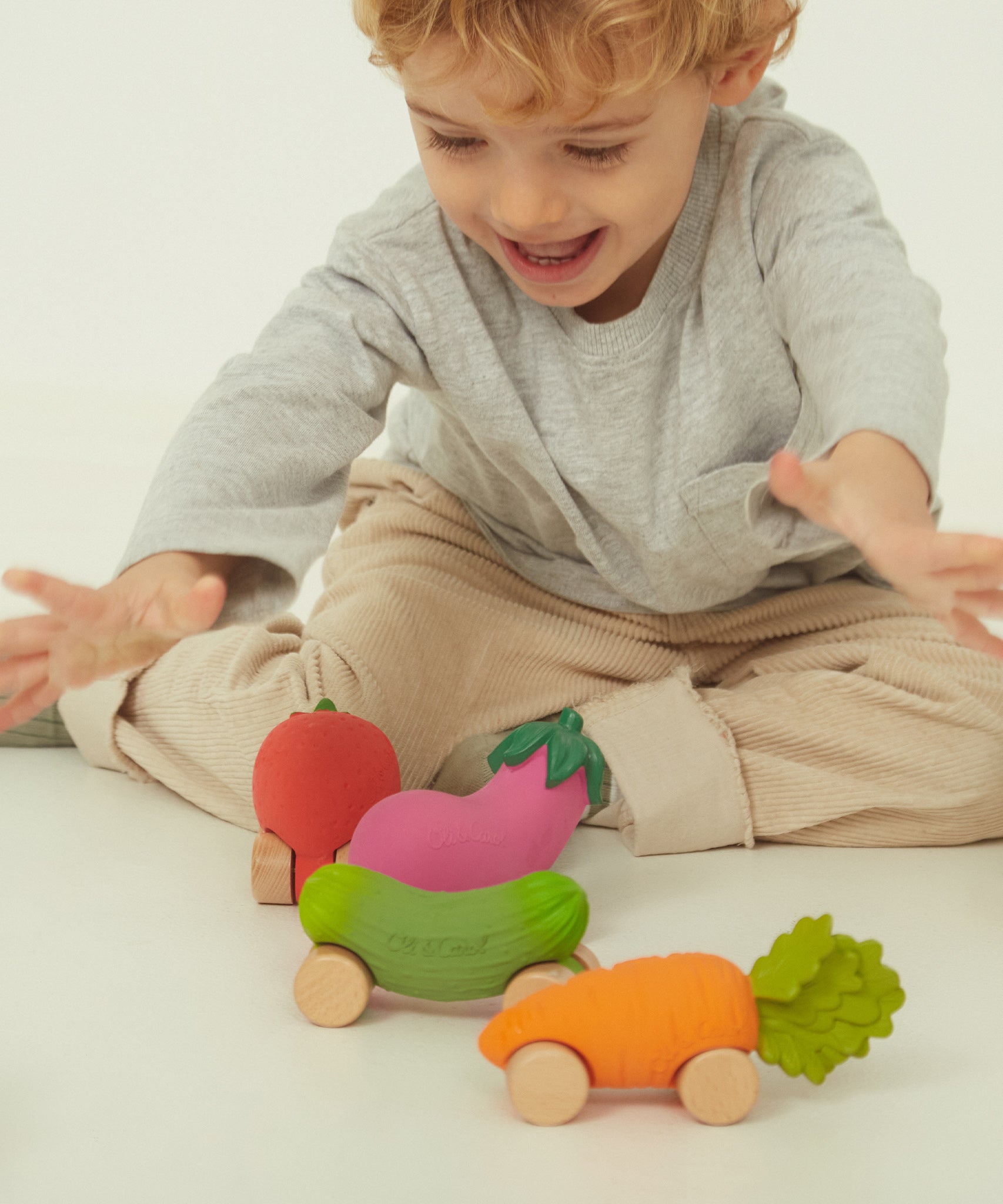 A closer look at the Oli & Carol Cathy The Carrot Baby Car. A fun orange carrot car with a green leafy top