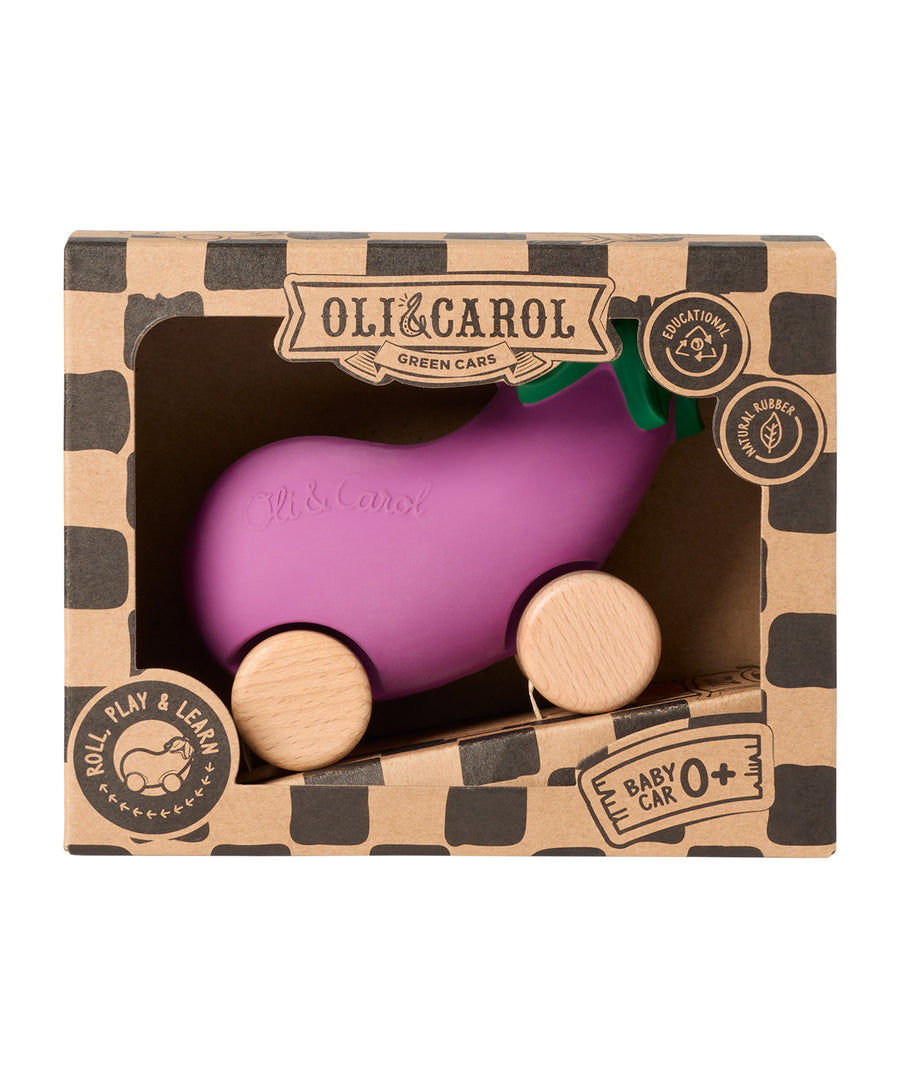 A child chewing on the Oli & Carol 100% Natural Rubber Emma the Eggplant Car