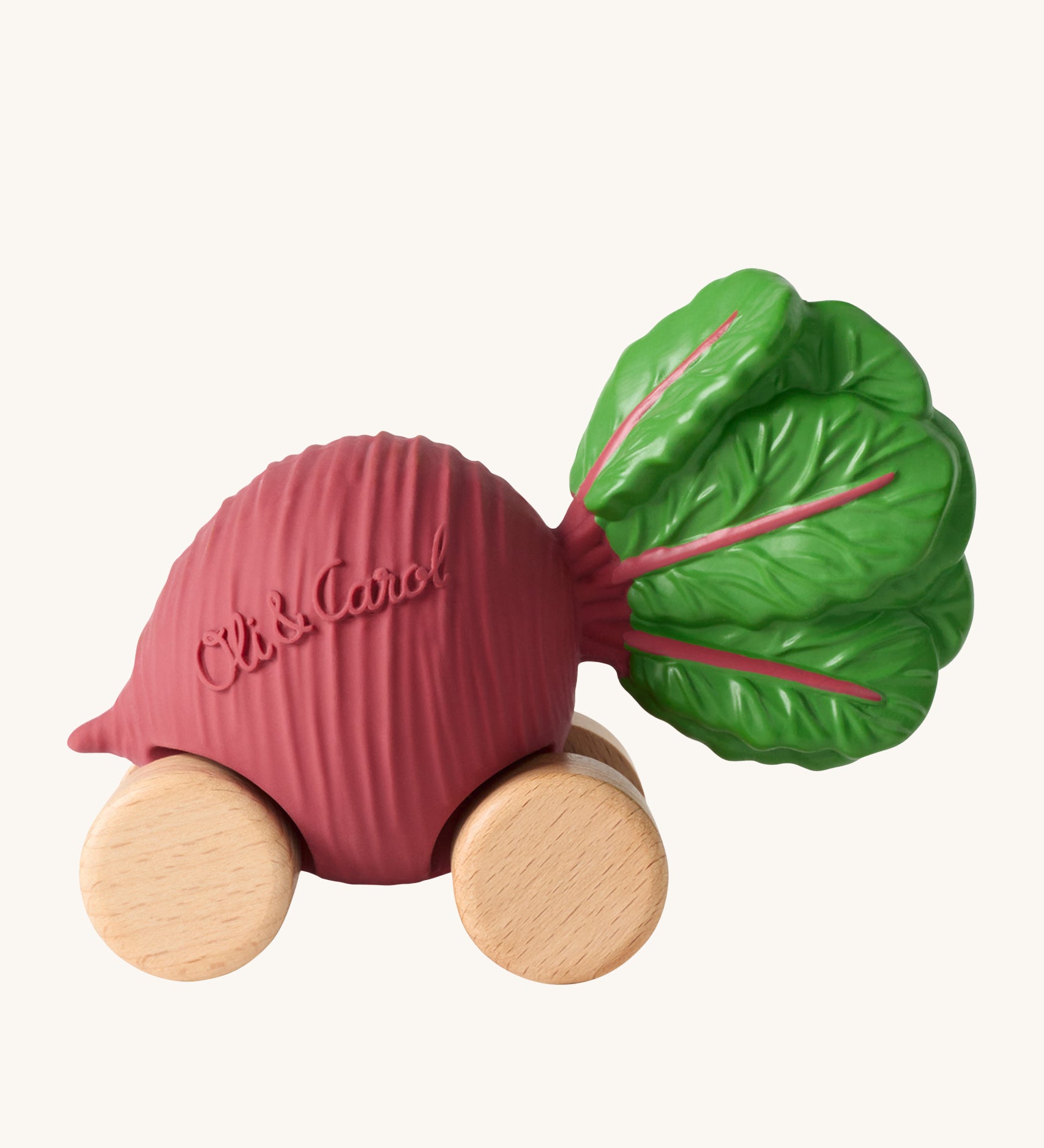 Oli & Carol Betty The Beetroot Baby Car. A fun purple beetroot car with a green leafy top, and wooden wheels on a cream background