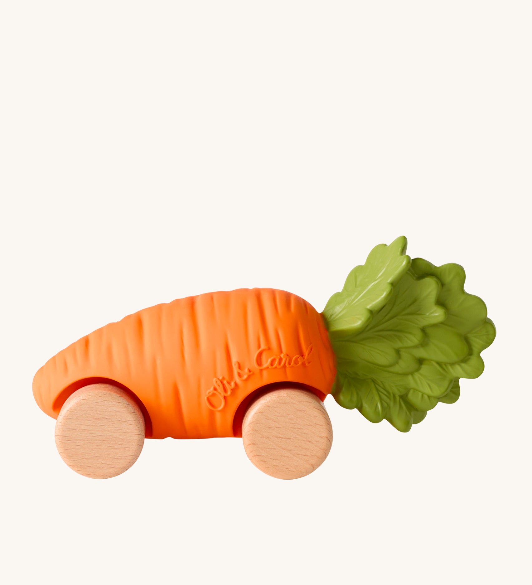 Oli & Carol Cathy The Carrot Baby Car. A fun orange carrot car with a green leafy top, and wooden wheels on a cream background