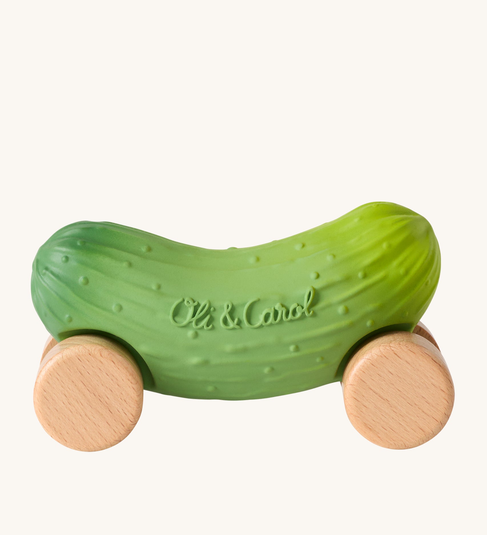 Oli & Carol Pepino The Pickle Baby Car. A fun green pickle car with a with wooden wheels on a cream background