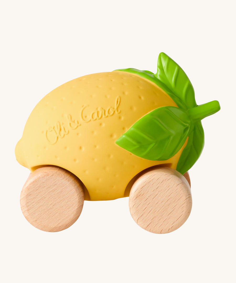 Oli & Carol Lou The Lemon Baby Car. A fun yellow lemon car with a green leafy top, and wooden wheels on a cream background