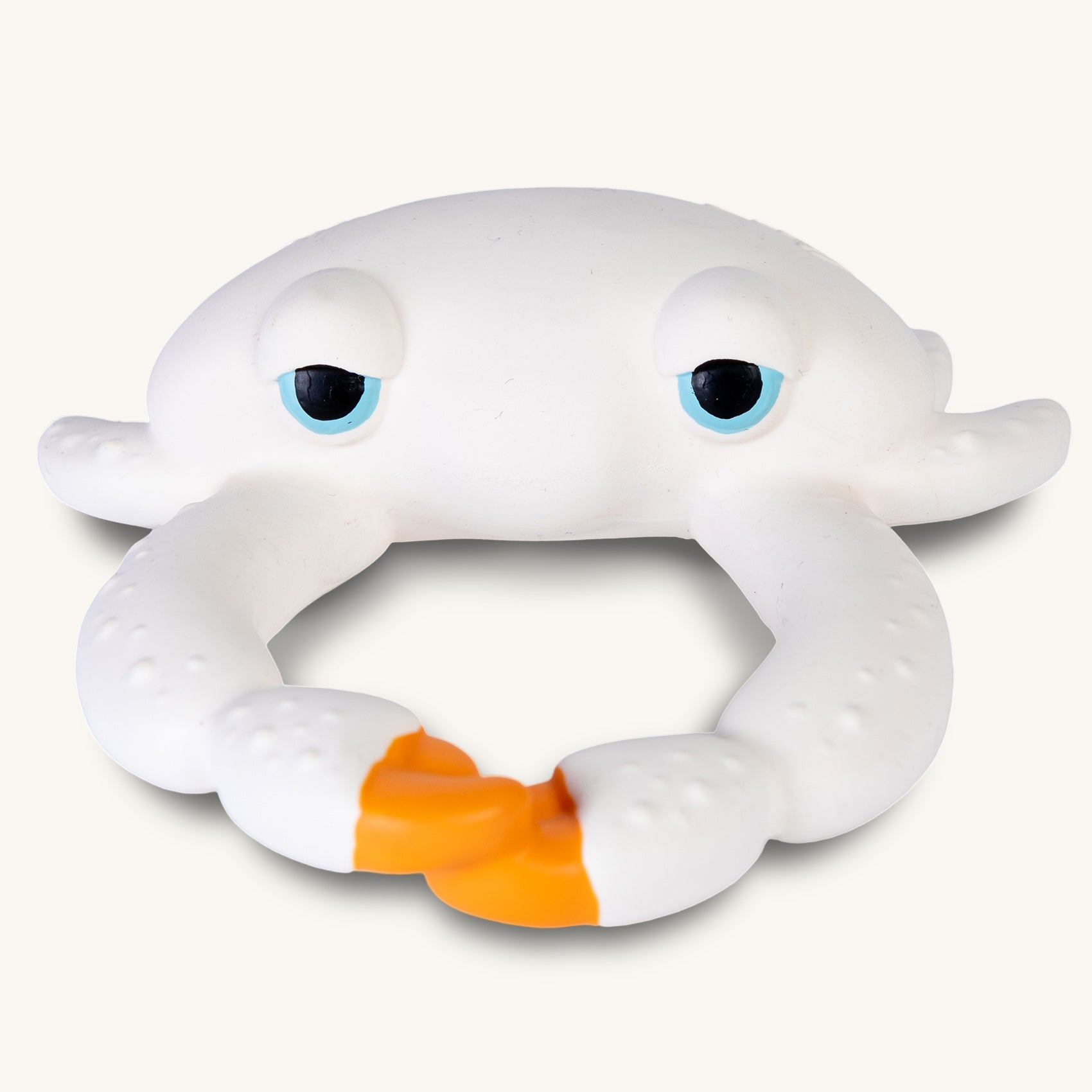 Picture of a baby swimming and holding the Oli and Carol Sharon the Crab rubber bath toy.