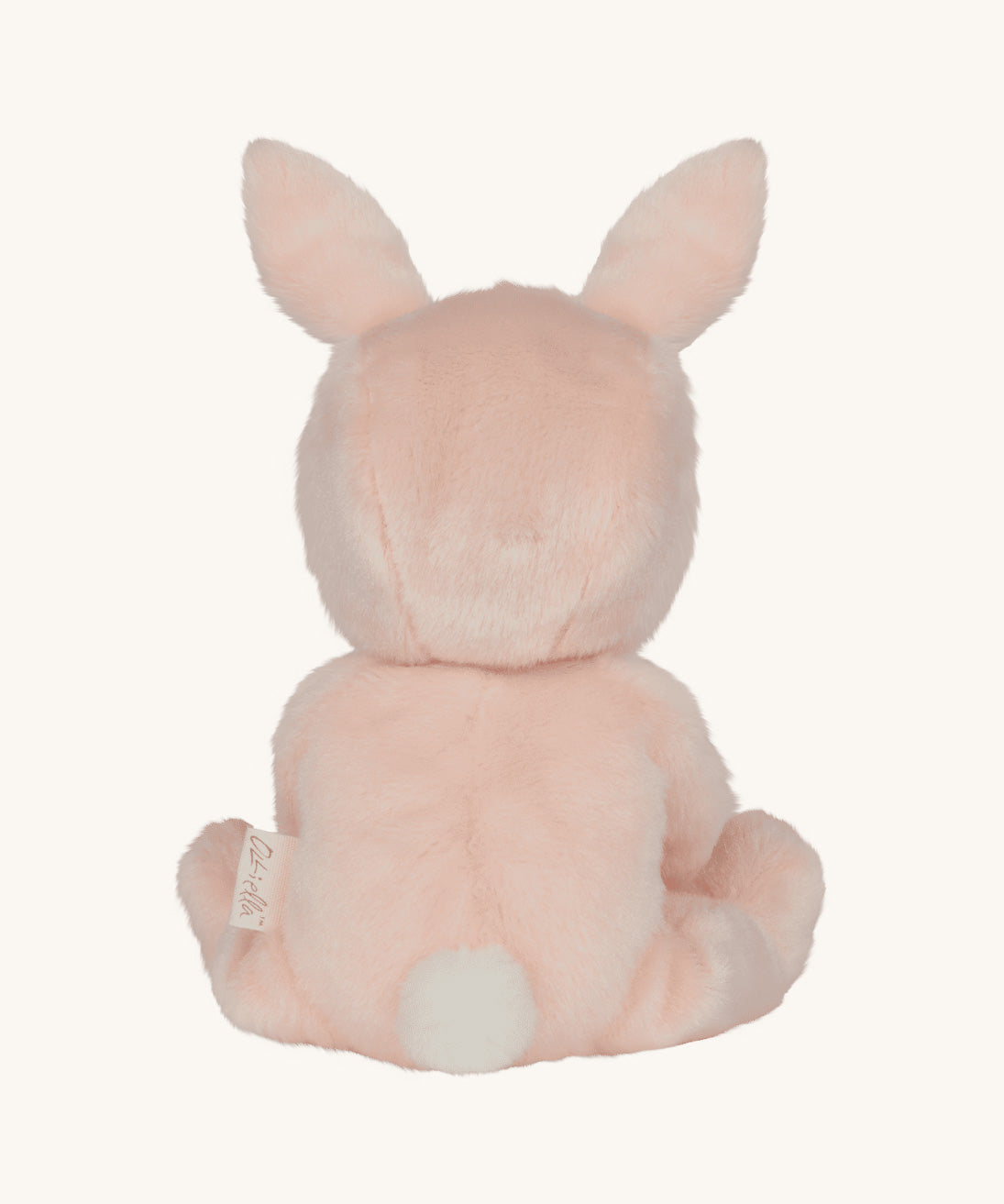 Olli Ella pink coloured Babbit Bunny Dinky Dinkum Doll in a seated position facing away from the camera showing the back of the dolly