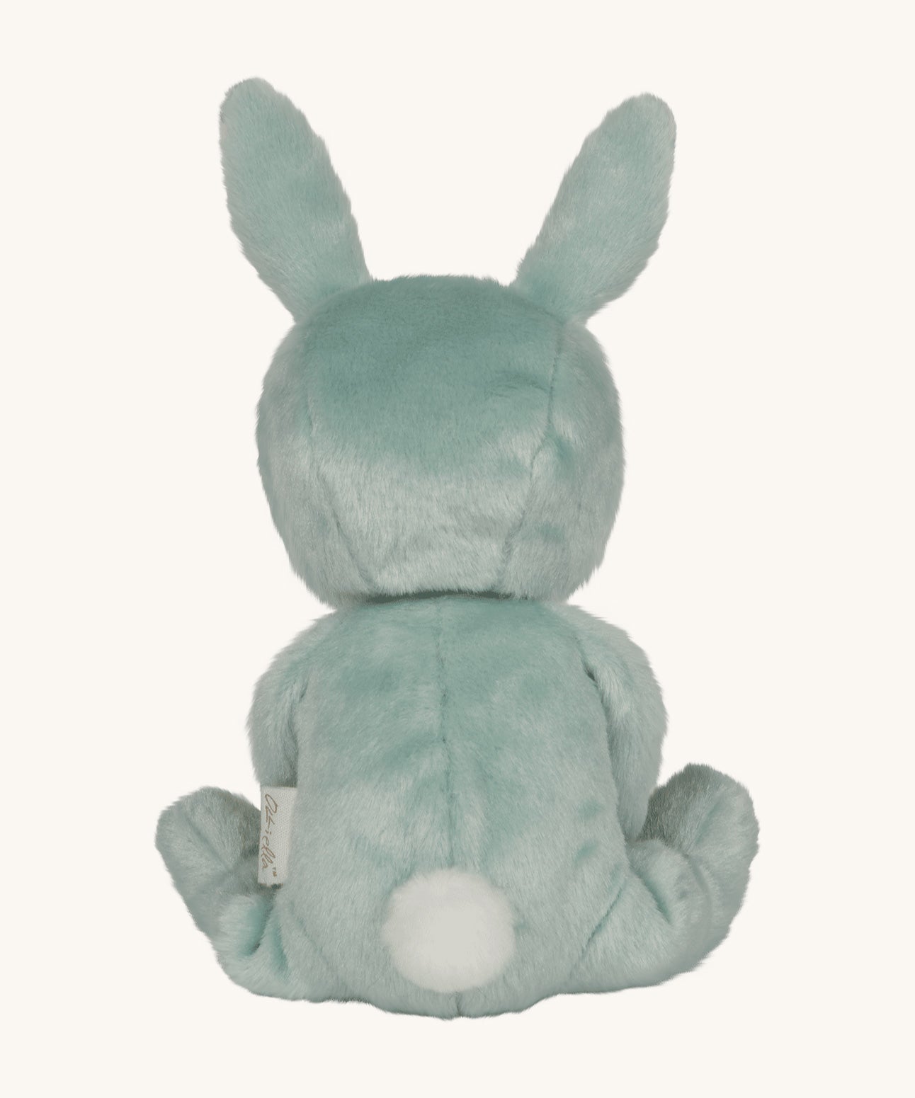 Olli Ella mint green coloured Biscuit Bunny Dinky Dinkum Doll in a seated position facing away from teh camera showing the back of the soft toy. The dinky has a round little white fluffy tail