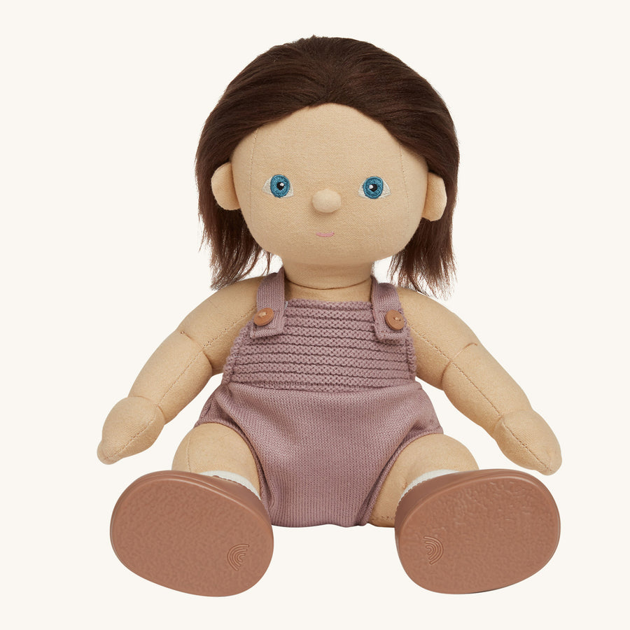 soft bodied Dinkum Doll standing up pictured on a plain coloured background