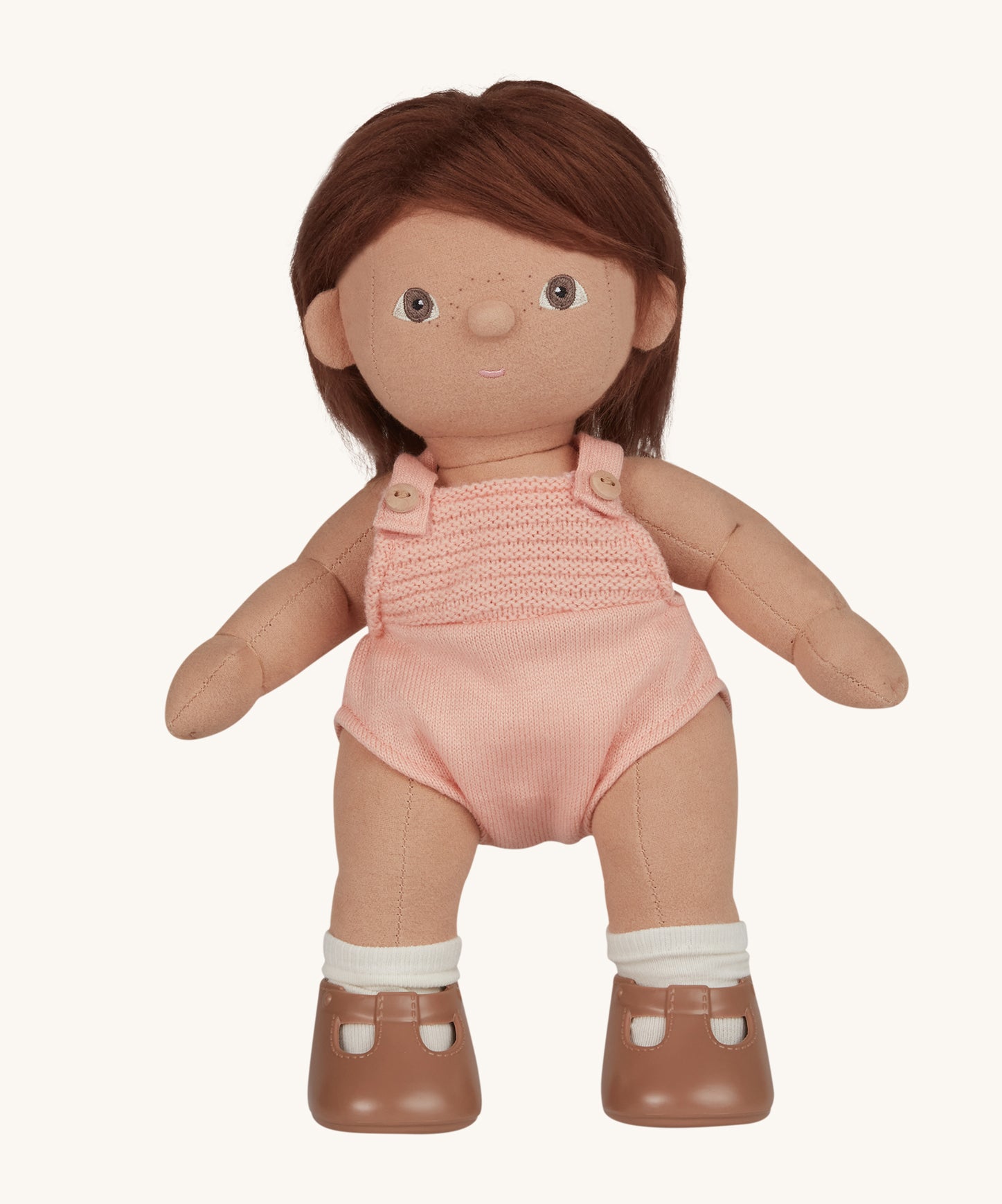 An Olli Ella Dottie Dinkum Doll on a plain background. The doll has brown hair and brown eyes. The hair is shown down. 